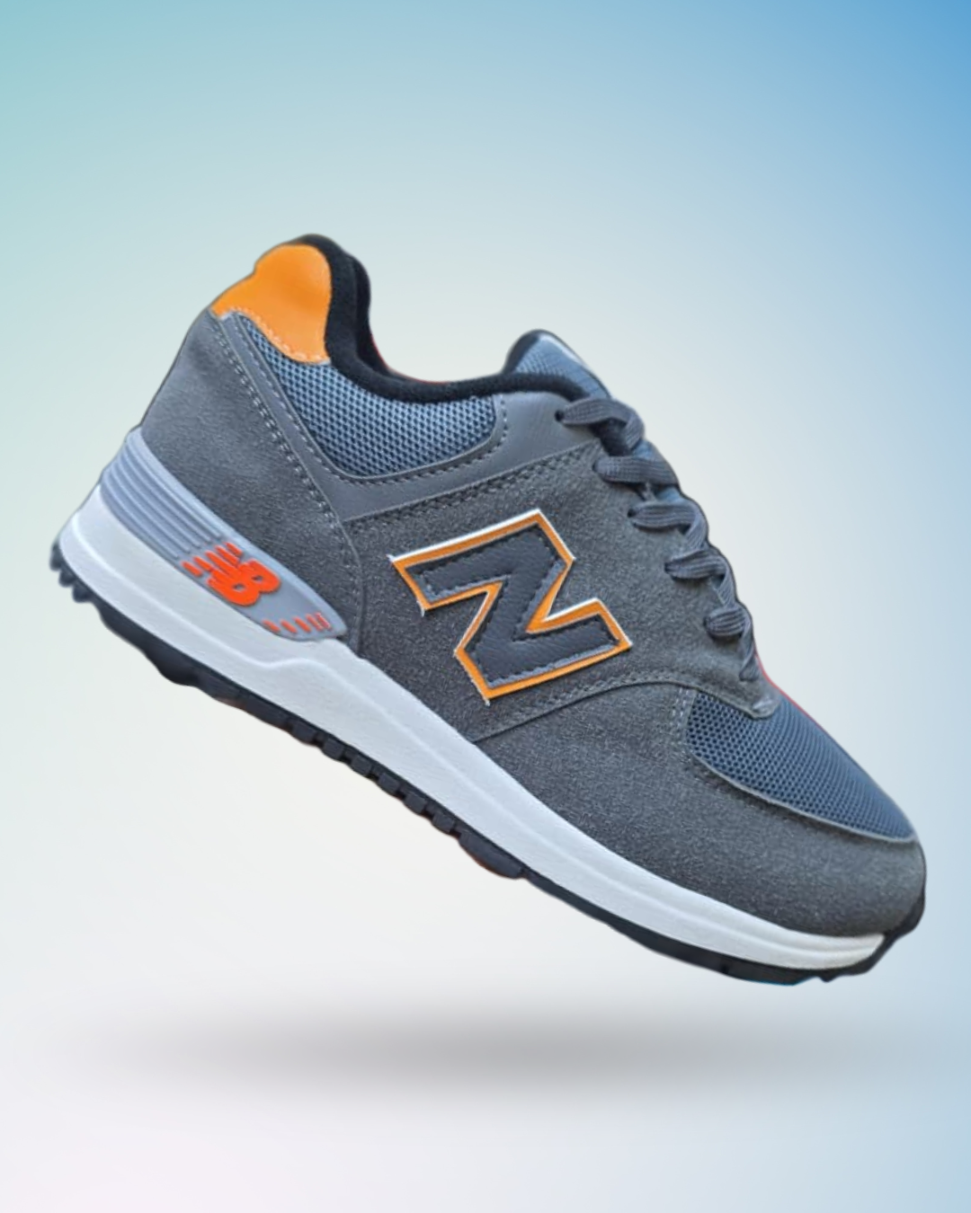 Zapatilla New Balance 574 color plomo naranja   para hombre, tallas del 39 al 43