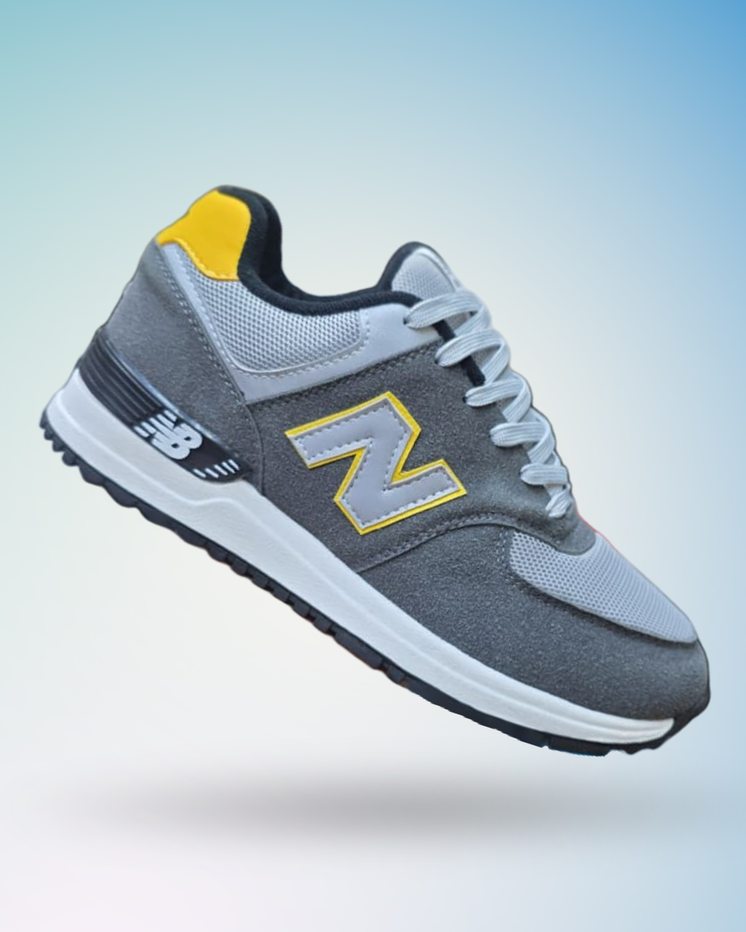 Zapatilla New Balance 574 color plomo amarillo   para hombre, tallas del 39 al 43